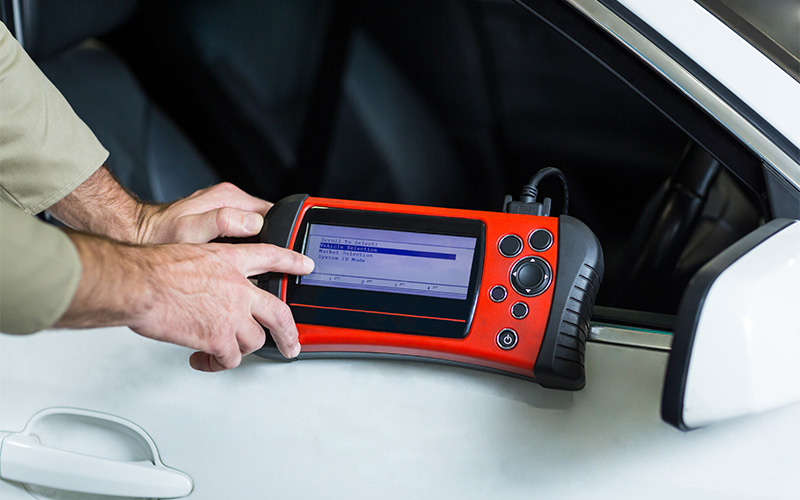 Image of a person using a diagnostic tool