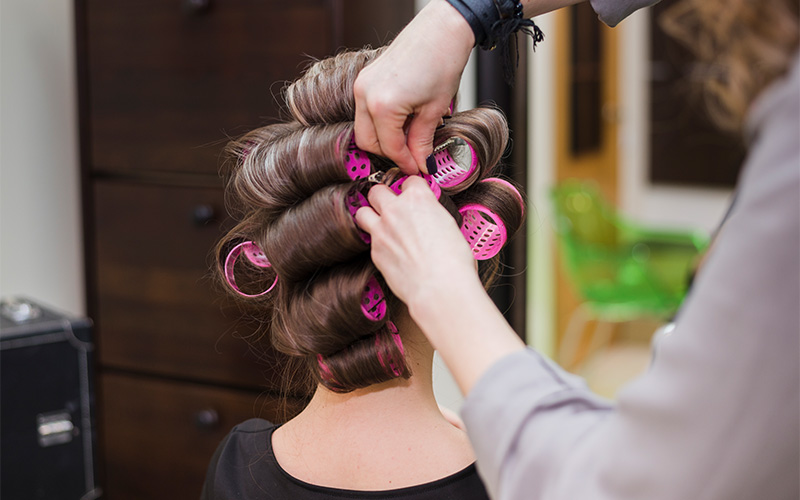 A customer receiving a perm