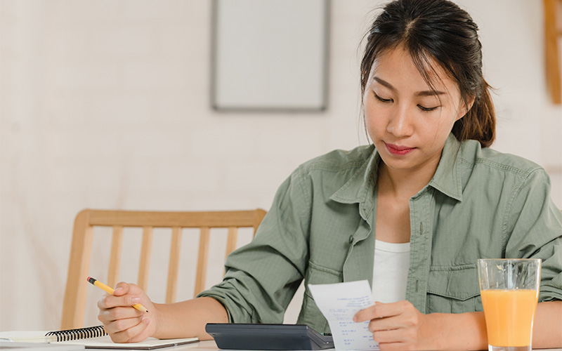 Image of a person budgeting and checking finances