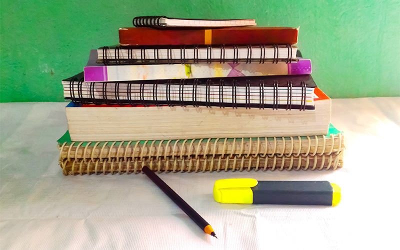 Image of notebooks and books of different subjects