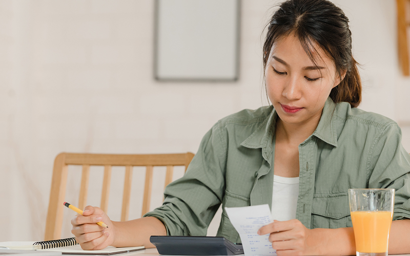 A person calculating his expenses