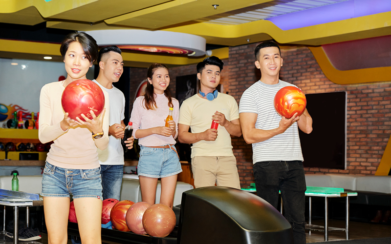 Image of a group of friends playing bowling