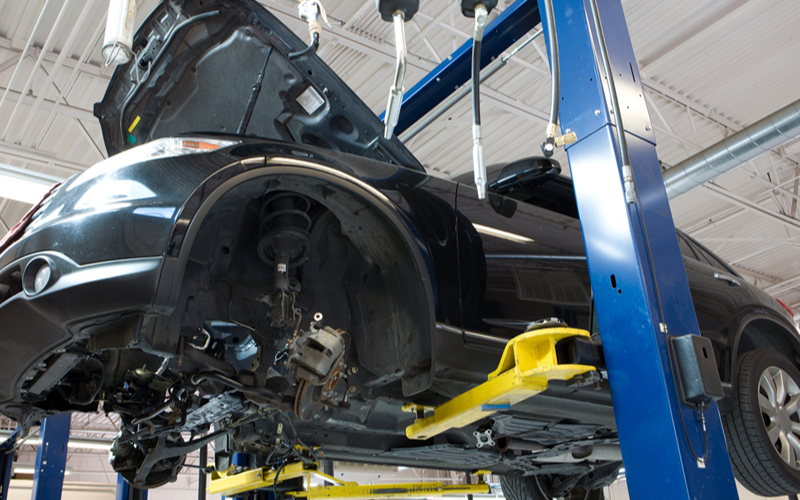 a car in a hydraulic car lift