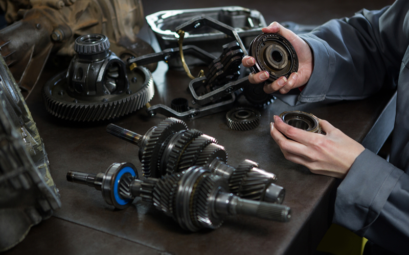 a hand holding a car’s gear