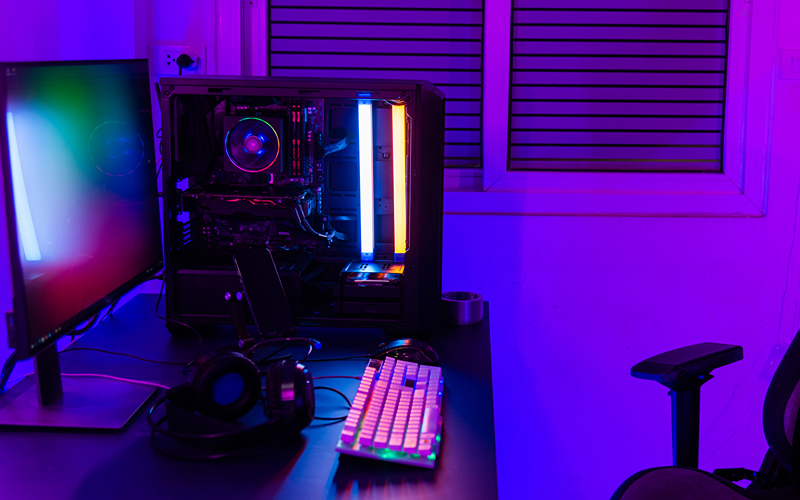 gaming computer setup in a neon-lighted room