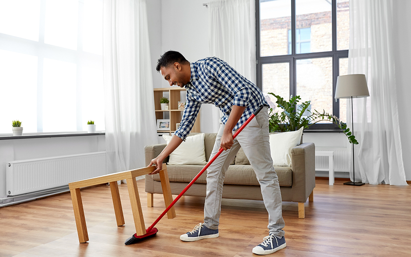A person cleaning his house