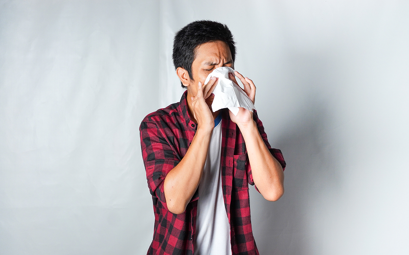 Image of a person sneezing