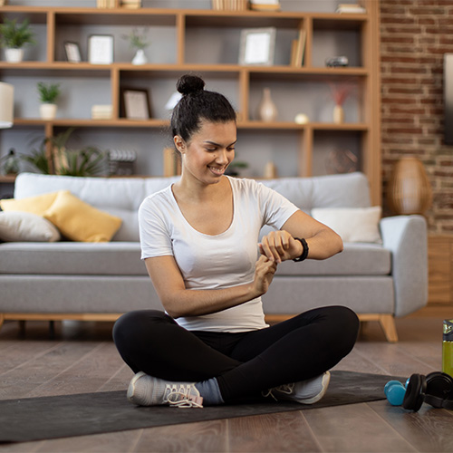 Small image of a small timer and person doing yoga