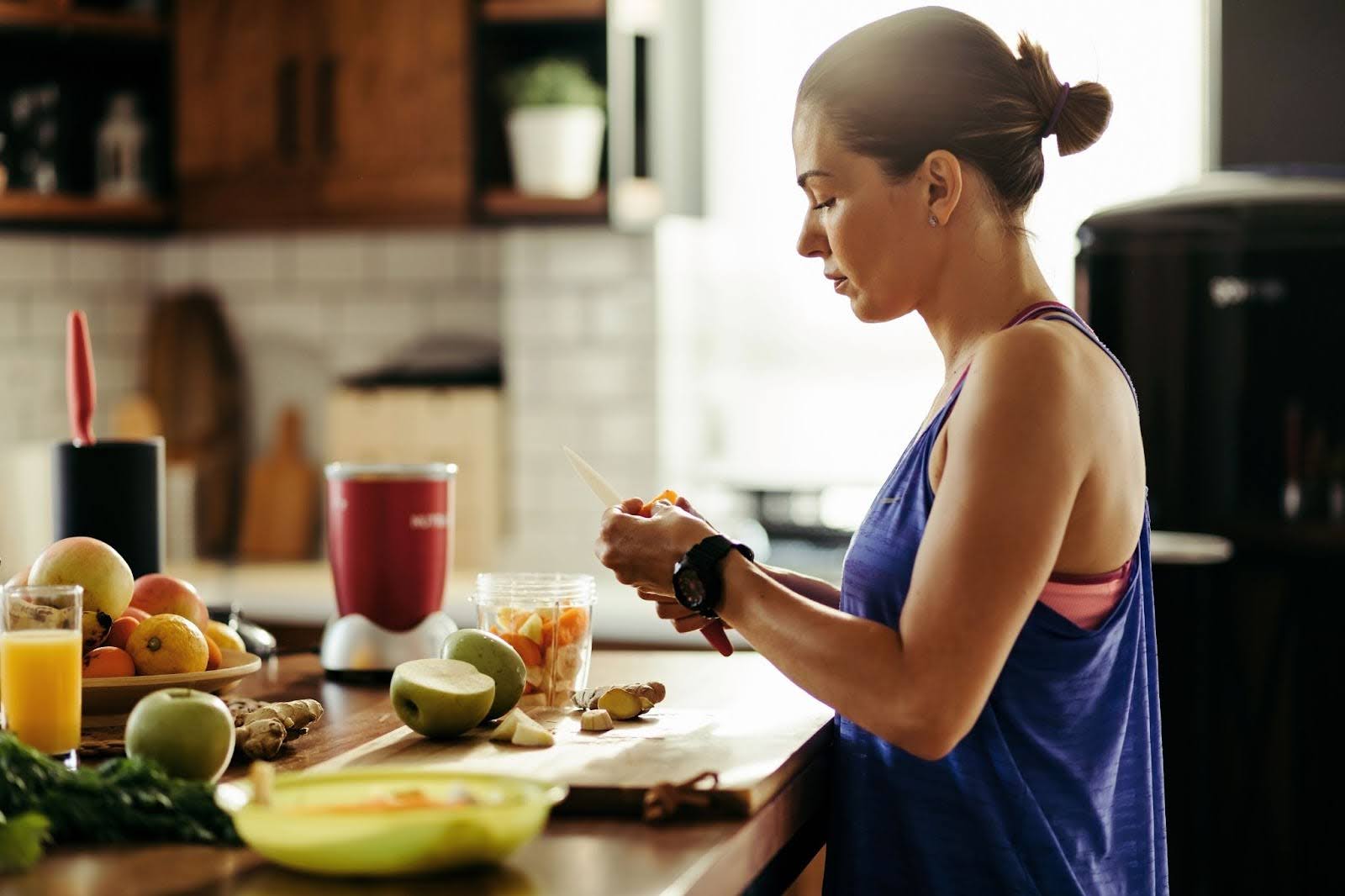 a healthy, athletic person preparing a healthy brunch plate at home