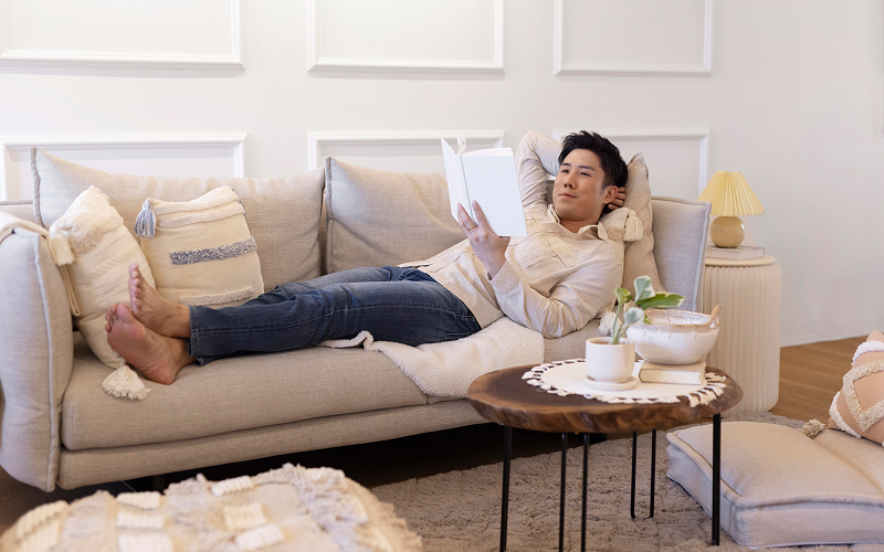 a person relaxing in a living room with an aircon
