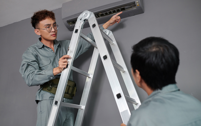 a specialist installing an aircon unit