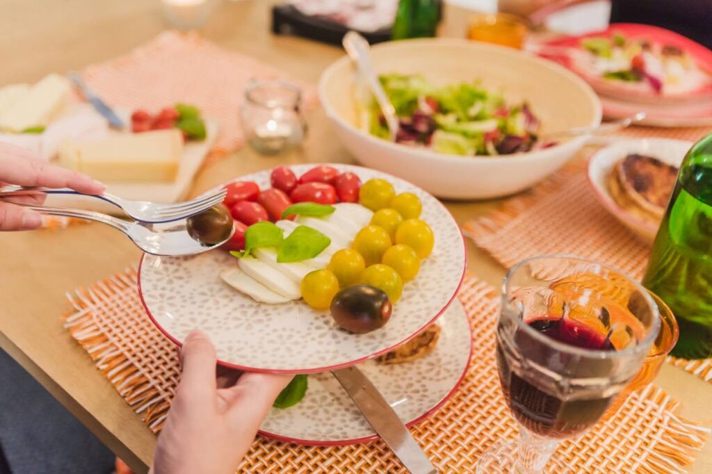 a vegetable-filled brunch plate being served on a table