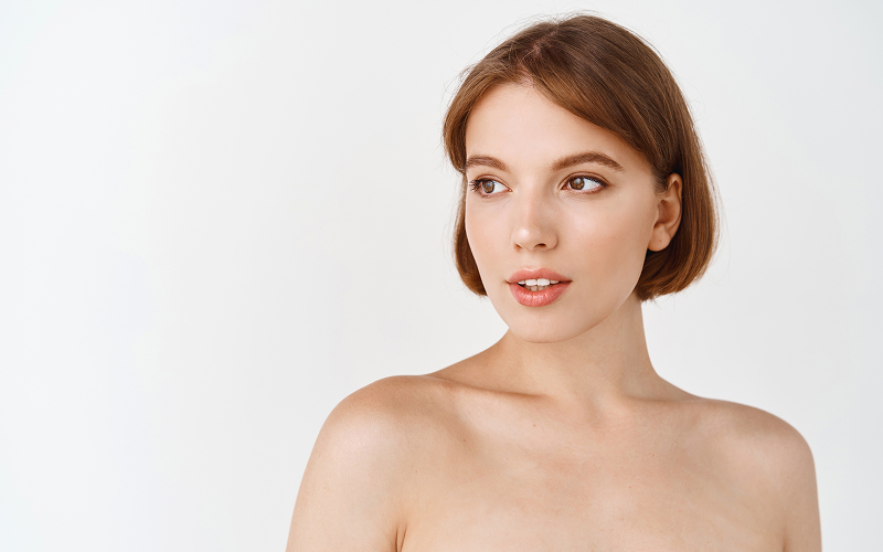 Woman showcasing youthful, firm skin after non-surgical facial rejuvenation.